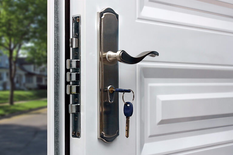 Open door of a family home. Close-up of the lock with your keys